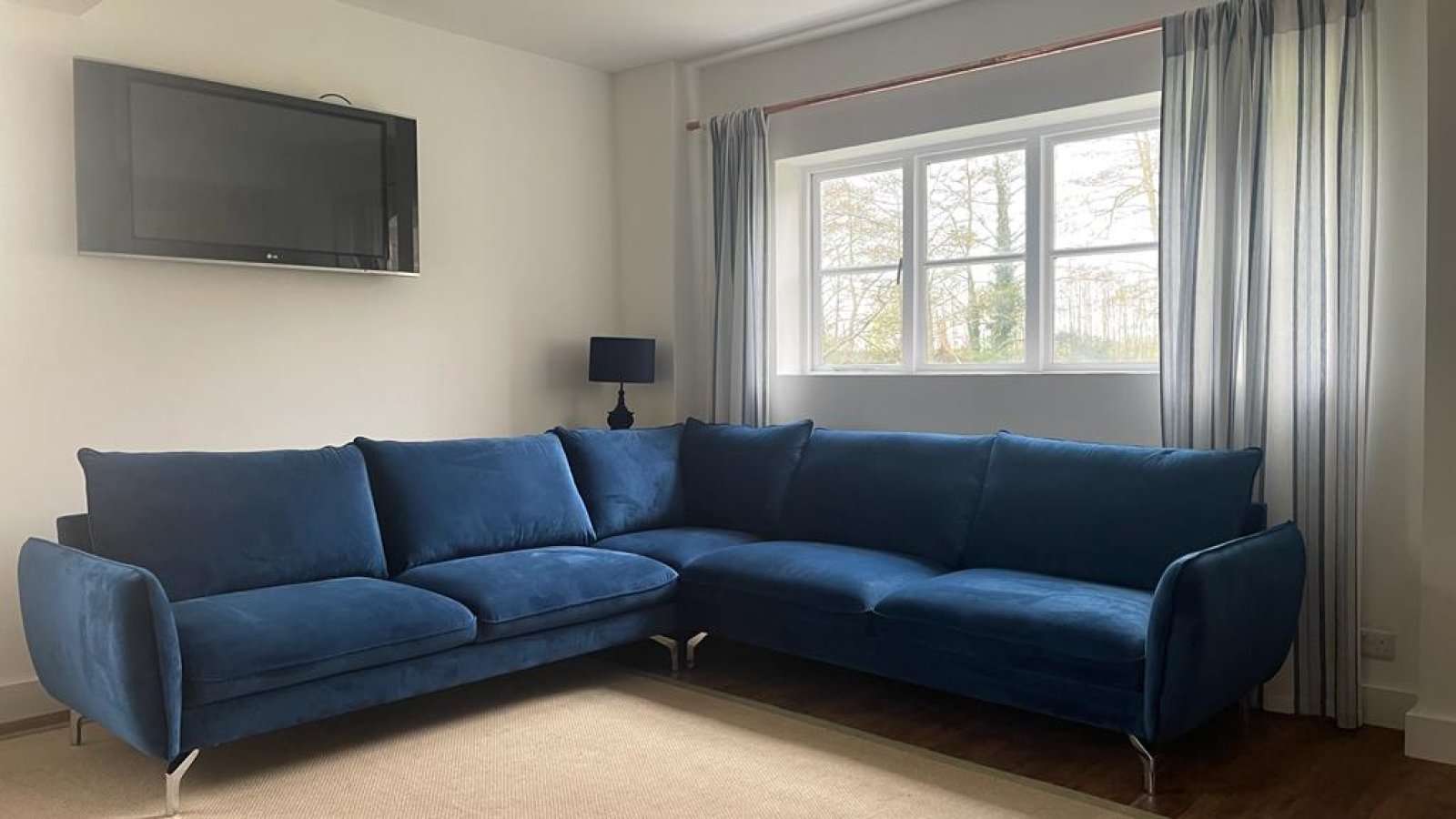 Corner sofa navy blue: maximizing space without compromising style