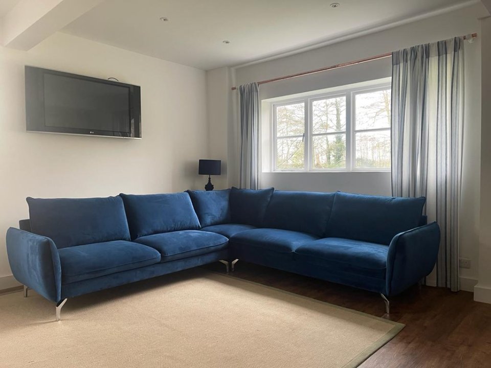 Corner sofa navy blue: maximizing space without compromising style