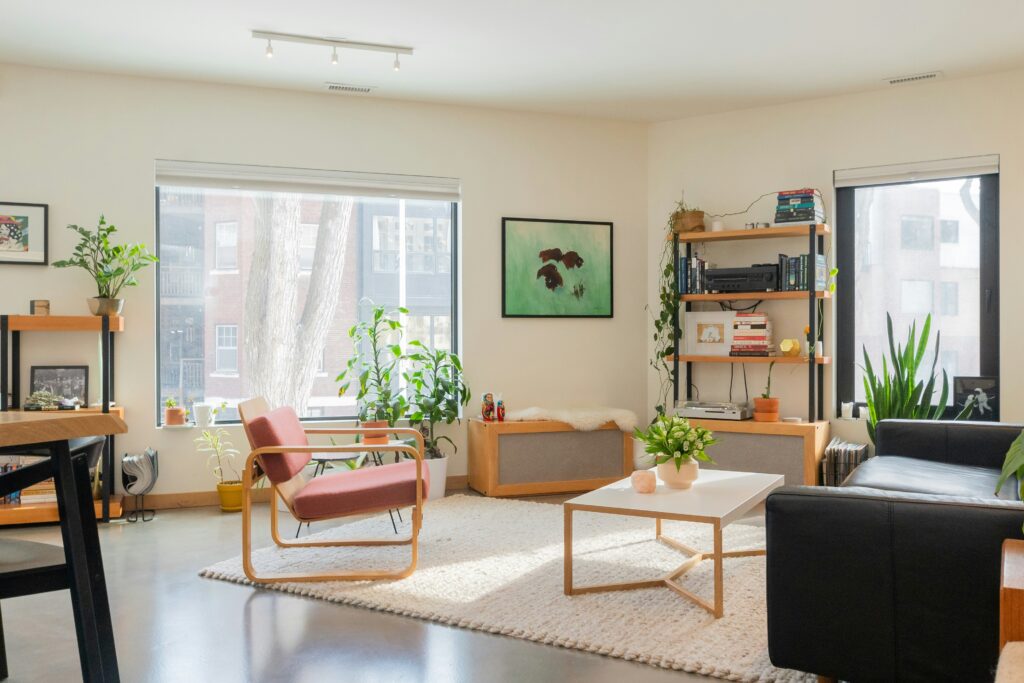 spacious room with beige walls and natural furniture